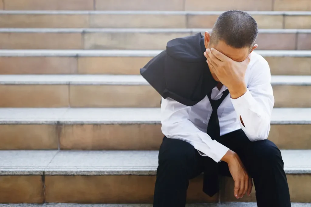 stress man sitting on a stairs