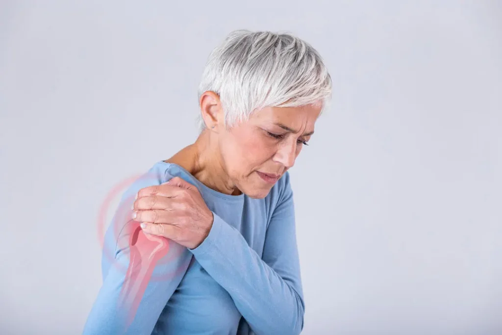 An old woman having pain in her shoulder. 